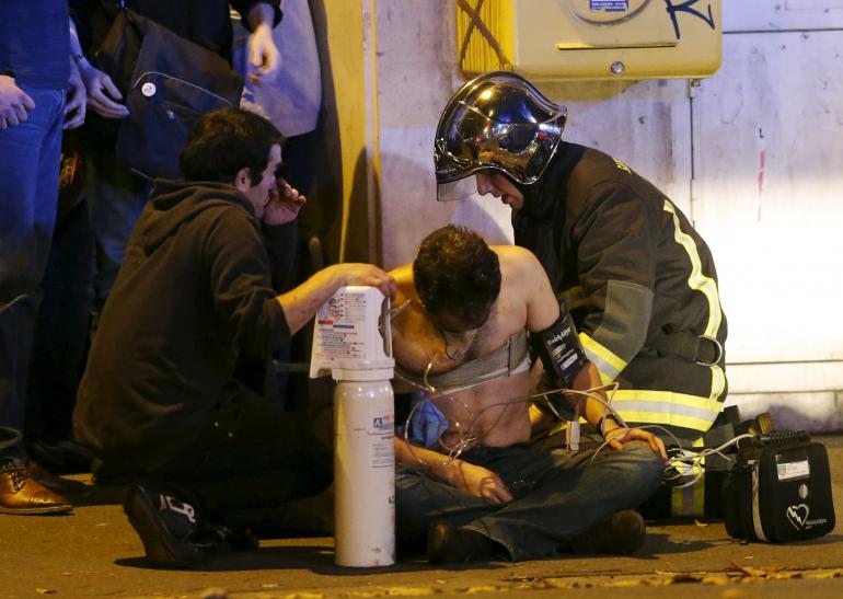 French first respondersaid an injured individual near the Bataclan concert hall following fatal shootings in Paris, France, November 13, 2015. | REUTERS/Christian Hartmann