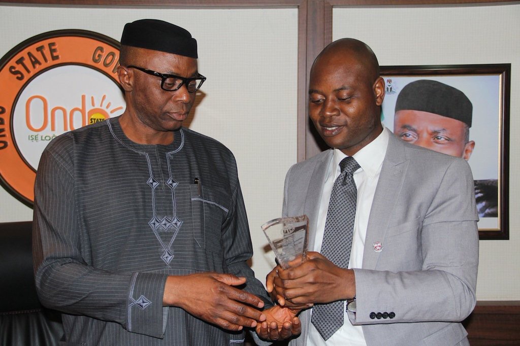 Governor Segun Mimiko receiving an award for his contribution to healthcare in Ondo | Ondo Gov't Photo