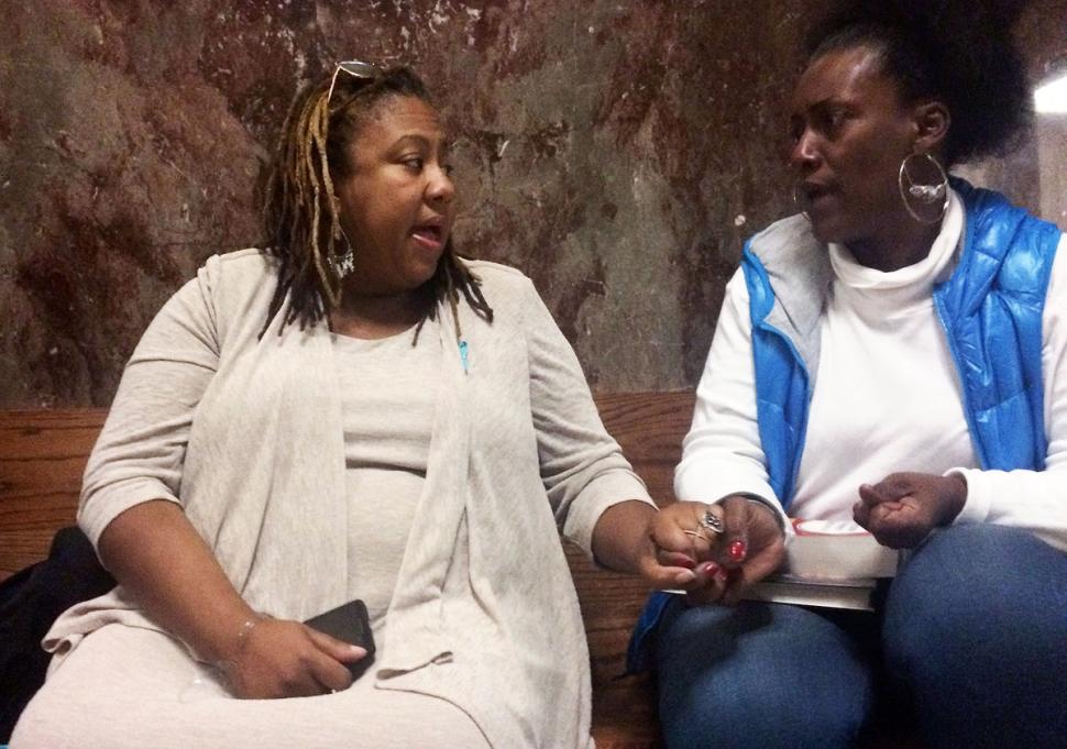 Rev. T. Sheri Dickerson and Robin Leake wait for a verdict on Thursday. | Heidi Banders/Reuters