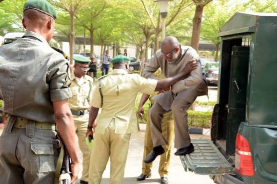 Chief Olisah Metuh, National Publicity Secretary of the PDP arrives the courts Tuesday, Jan 19, 2015 in handcuffs | NAN