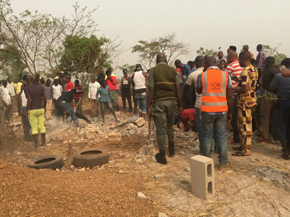 Security agents and eyewitnesses at Ugwuaji Enugu State where dead bodies were discovered under the foundation of a church building | Daily Post
