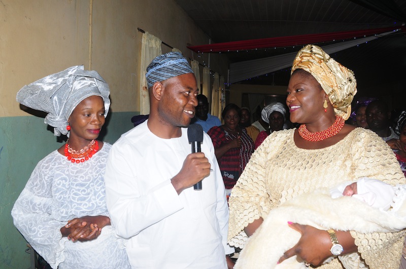 Ondo First Lady, Mrs Olukemi Mimiko, wrapping First Baby of the Year, Baby Adewon, around her arms, State Commissioner for Health, Dr Dayo Adeyanju and Mother of the First Baby, Mrs Adewon at the Post-Natal ward of the State Specialist Hospital Akure on Friday | Ondo TV