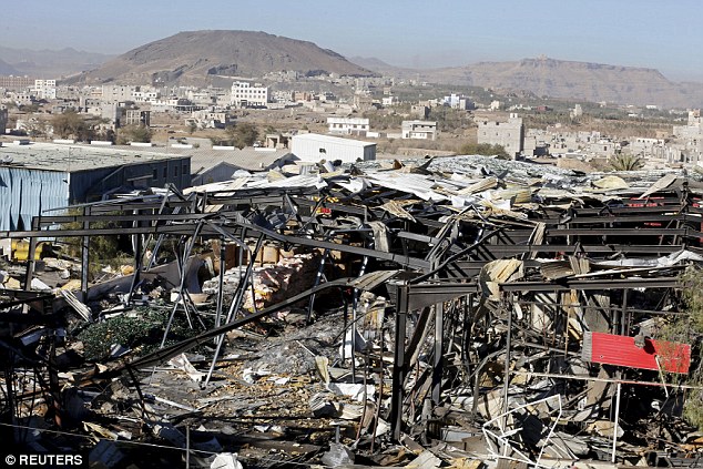 Saudi jets have 'deliberately' hit the Iranian embassy in Yemen in an air raid that wounded staff, Tehran has claimed today. Pictured: bomb damage in the capital Sanaa on December 30 | Reuters