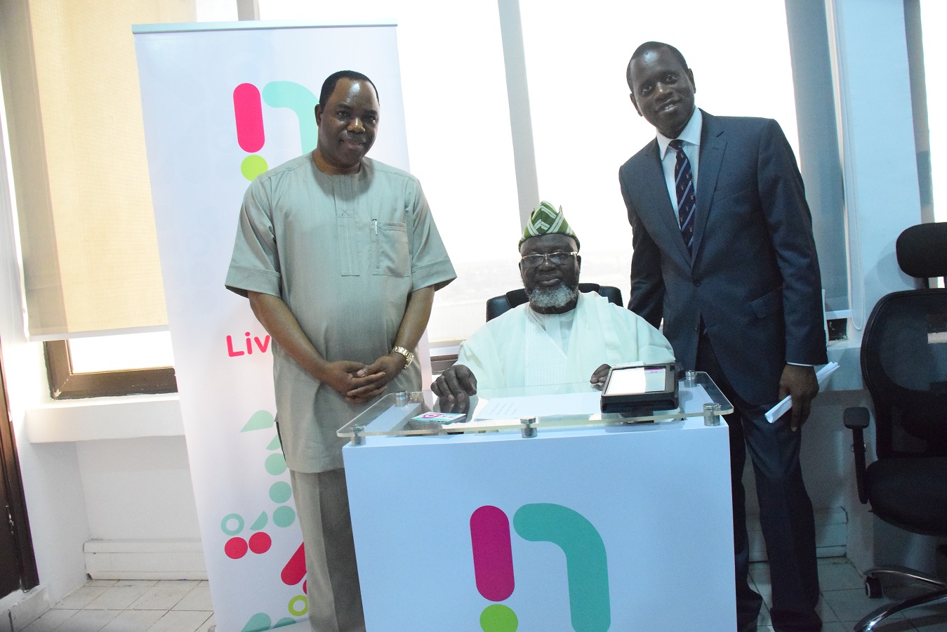 (L-R) Dr. Tunde Ayeni, chairman NatCom, Barrister Adebayo Shittu, minister of Communications and Kamar Abass, CEO ntel at ntel’s Marina Office in Lagos when the minister paid a courtesy visit and registered his SIM on the network. | ntel Photo