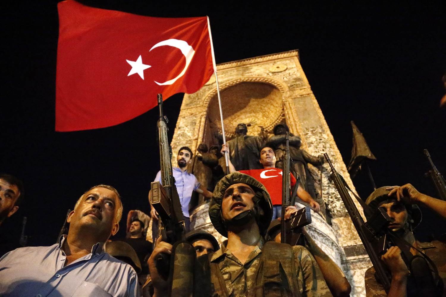 Soldiers loyal to the government of Turkey stand with citizens resisting the coup attempt of Friday, July 15, 2016 | Business Pundict
