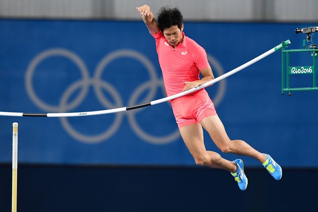 Japan's Hiroki Ogita competes in the Men's Pole Vault Qualifying Round during the athletics event at the Rio 2016 Olympic Games at the Olympic Stadium in Rio de Janeiro on August 13, 2016. | AFP/Franck Fife/Getty Images 