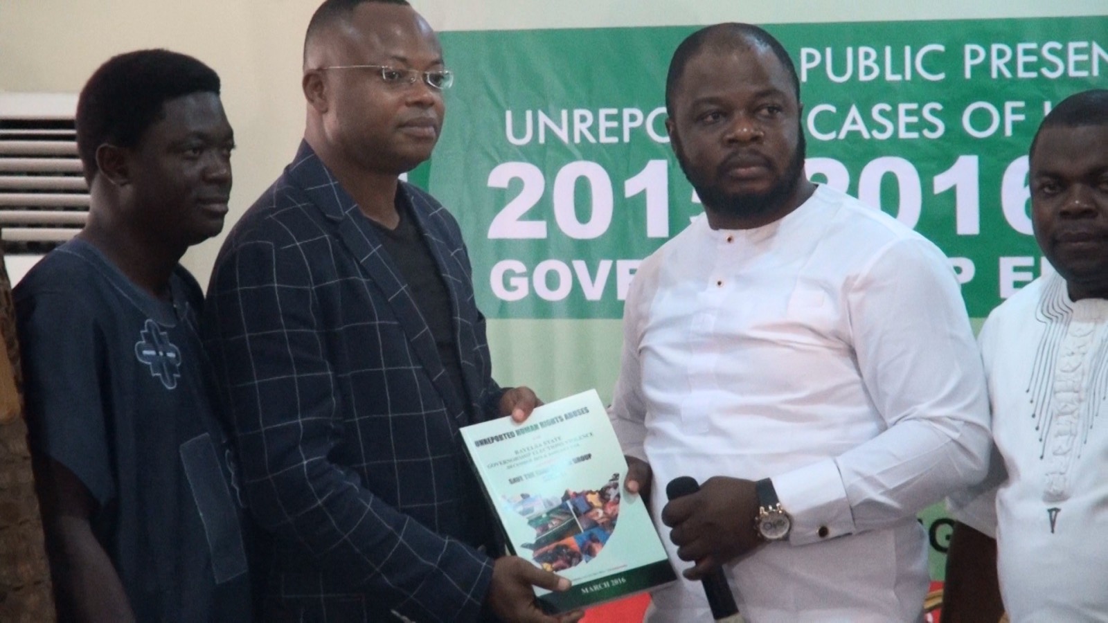 Mr. Ata Ikiddeh‎ (2nd left) a registered member of Amnesty International (UK Chapter) making a presentation at the presentation of the report on election killings in Southern Ijaw Local Government Area. The group, Save Ijaw Nation is led by Akindele Olufemi