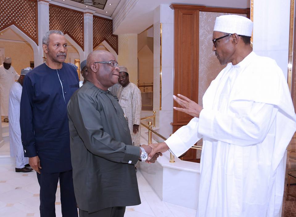 Supreme Court Justice Walter Onnoghen greets President Muhammadu Buhari when he hosted members of the judiciary in Aso Rock