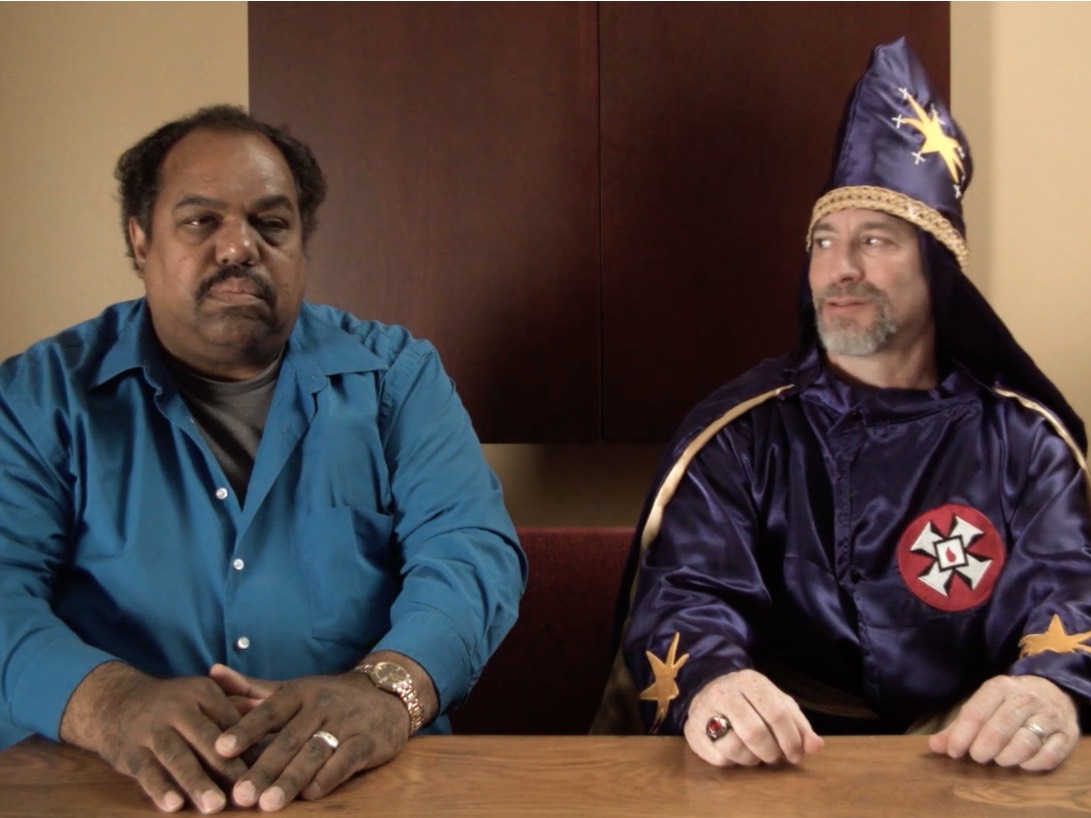 Davis with a KKK member of the Ku Klux Klan KKK