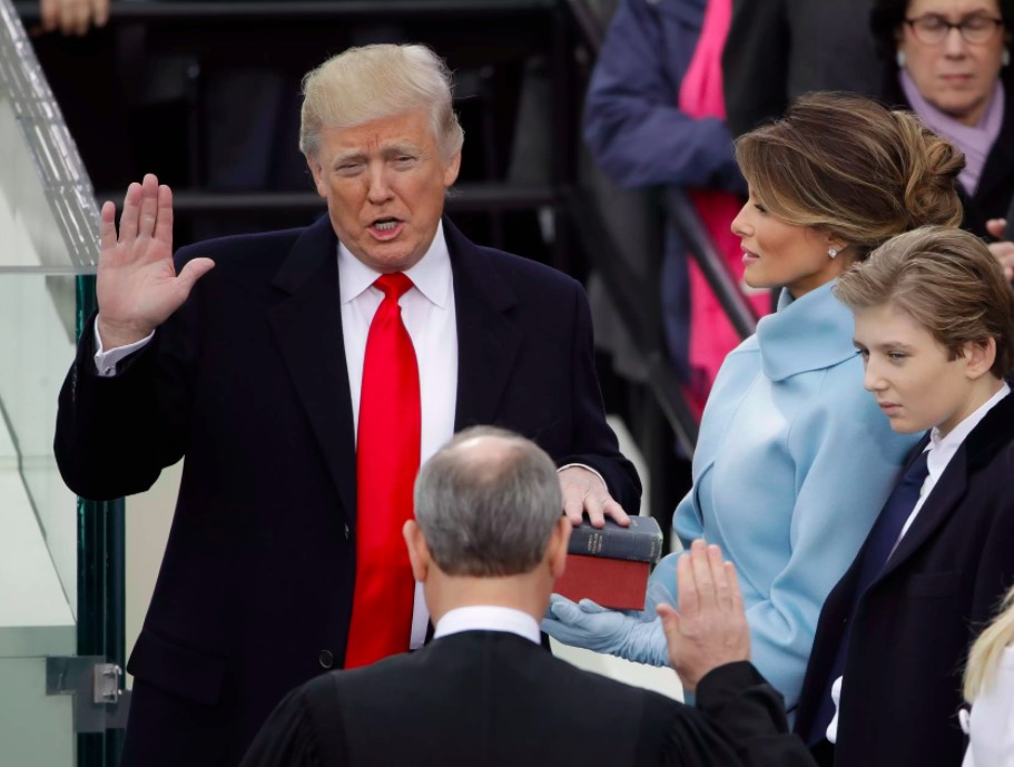 Donald Trump is sworn in as the 45th president of the United States by Chief Justice John Roberts as Melania Trump and their son Barron look on. (AP Photo/Matt Rourke)