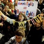 People gather in front of the U.S. Embassy in solidarity with the Women’s March in Washington and many other marches in several countries, in Tel Aviv