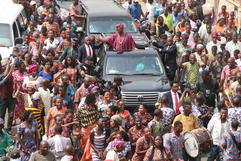 Former Governor of Ondo State, Dr Olusegun Mimiko, acknowledging cheers from supporters as he heads to the venue of the 'welcome home' reception
