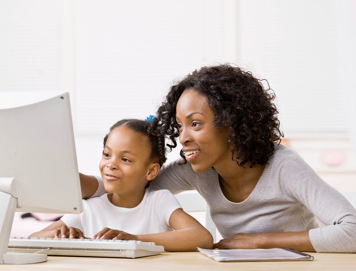 Alpha, technology education Mother daughter girl homework internet laptop