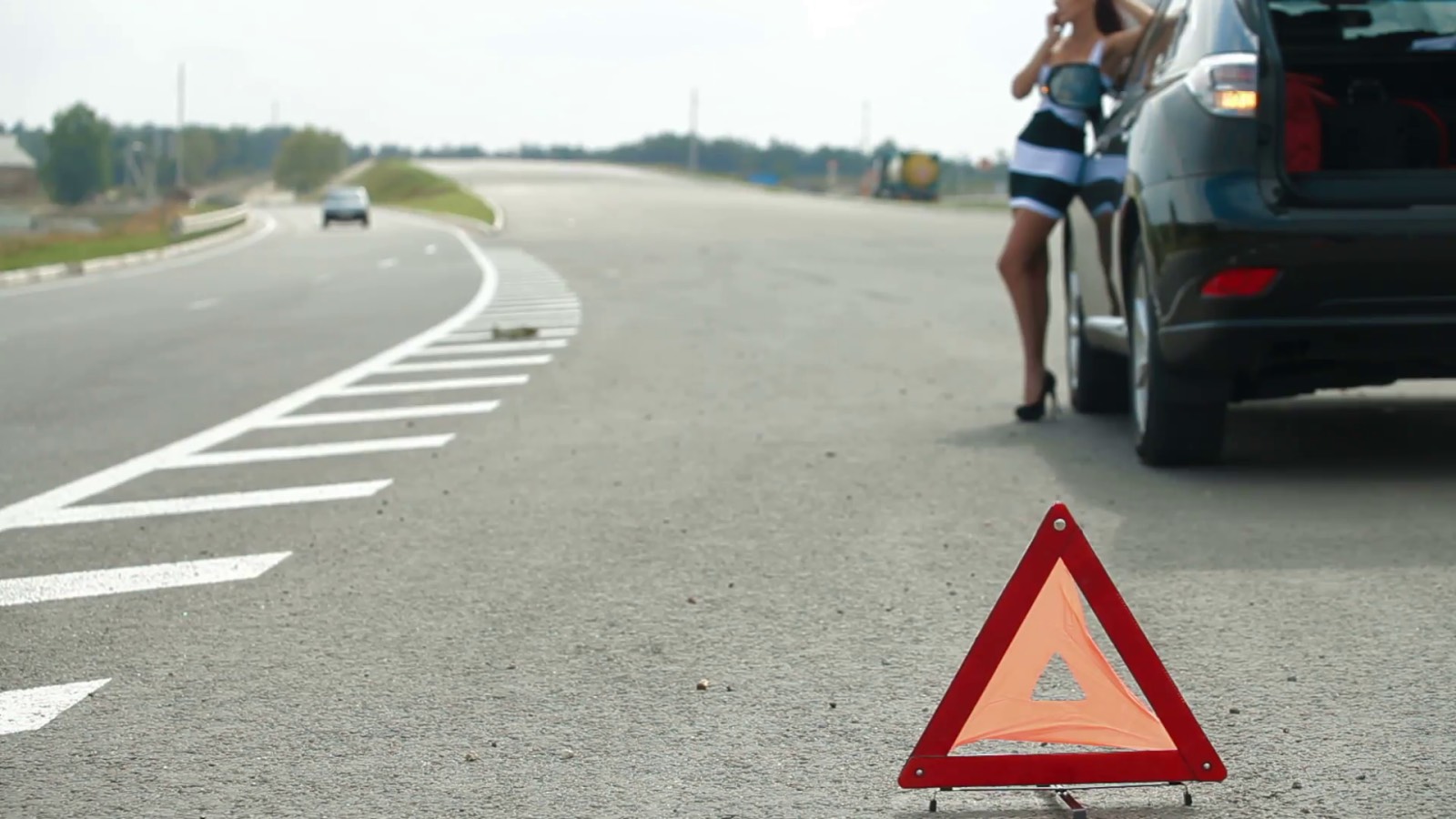 stranded woman on road car