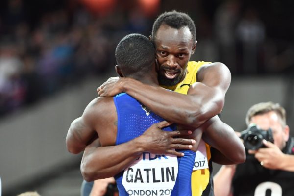Usain Bolt embraces Gatlin, who takes the gold