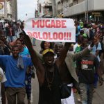 Protesters calling for Zimbabwean President Robert Mugabe to step down take to the streets in Harare