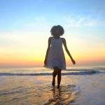 silhouette-of-african-american-girl-dancing-on-beach-on-vacation-at-sunset_rt2ursen_thumbnail-full01_Fotor