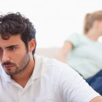 Couple mad at each other in their living room