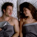 sweet-couple-in-bed-lokking-at-each-other