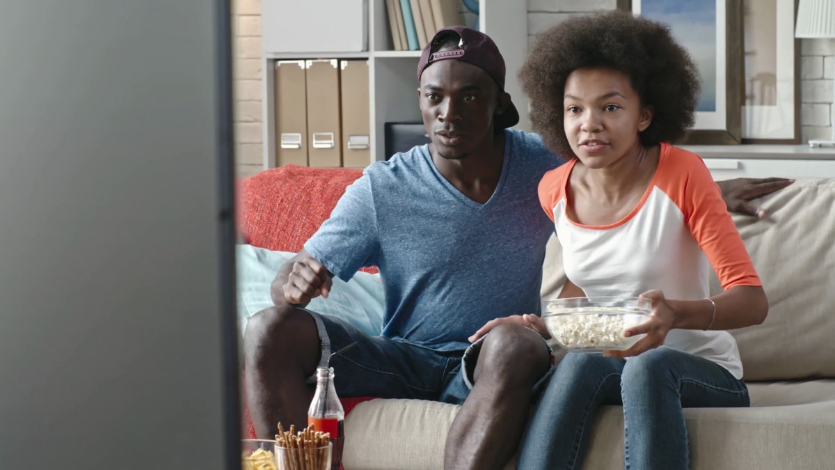 Young couple watching TV love