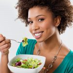 African American Woman Eating Salad