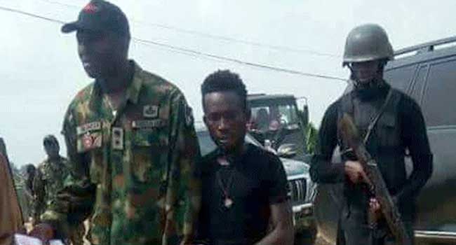 Karowei (middle) militant