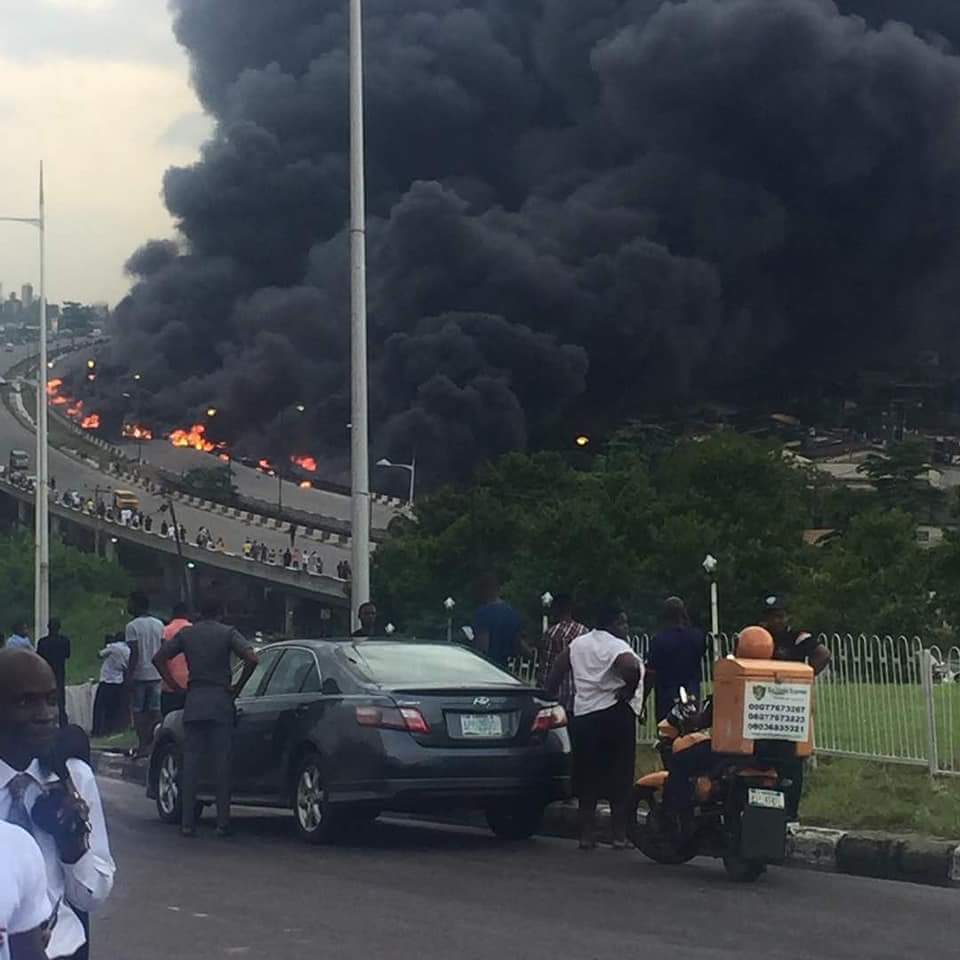 Fire burns vehicles at the scene of the tanker fire at Otedola bridge, Lagos in July 2018| NAN
