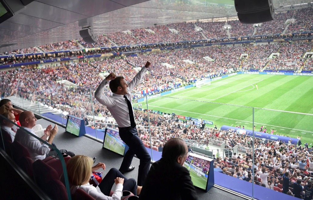 French President Emmanuel Macron (C) reacts to France's victory. AAP