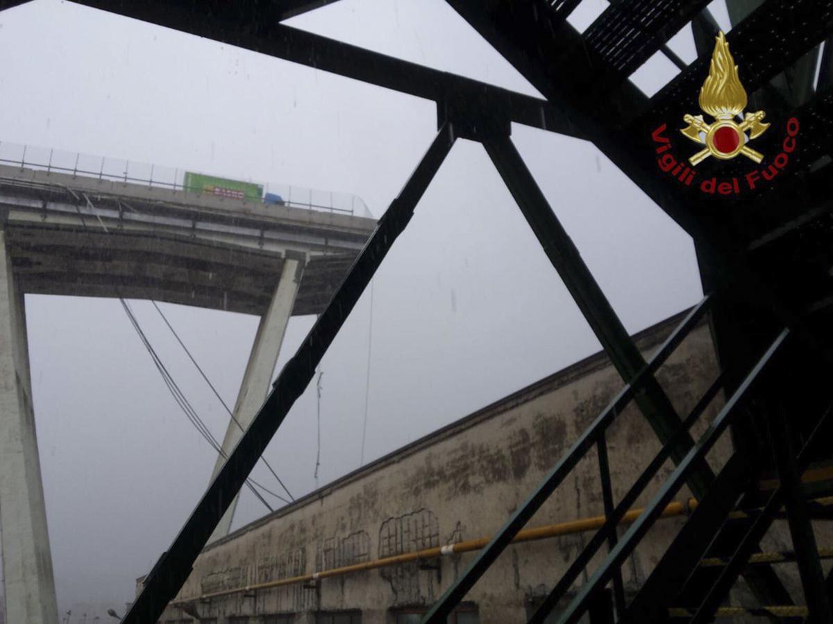 A view of the collapsed Morandi highway bridge in Genoa, Tuesday, Aug. 14, 2018. Italian authorities say that about 10 vehicles were involved when the raised highway collapsed during a sudden and violent storm in the northern port city of Genoa, while private broadcaster Sky TG24 said the collapsed section was about 200-meter long (650 feet). | Luca Zennaro/ANSA via AP