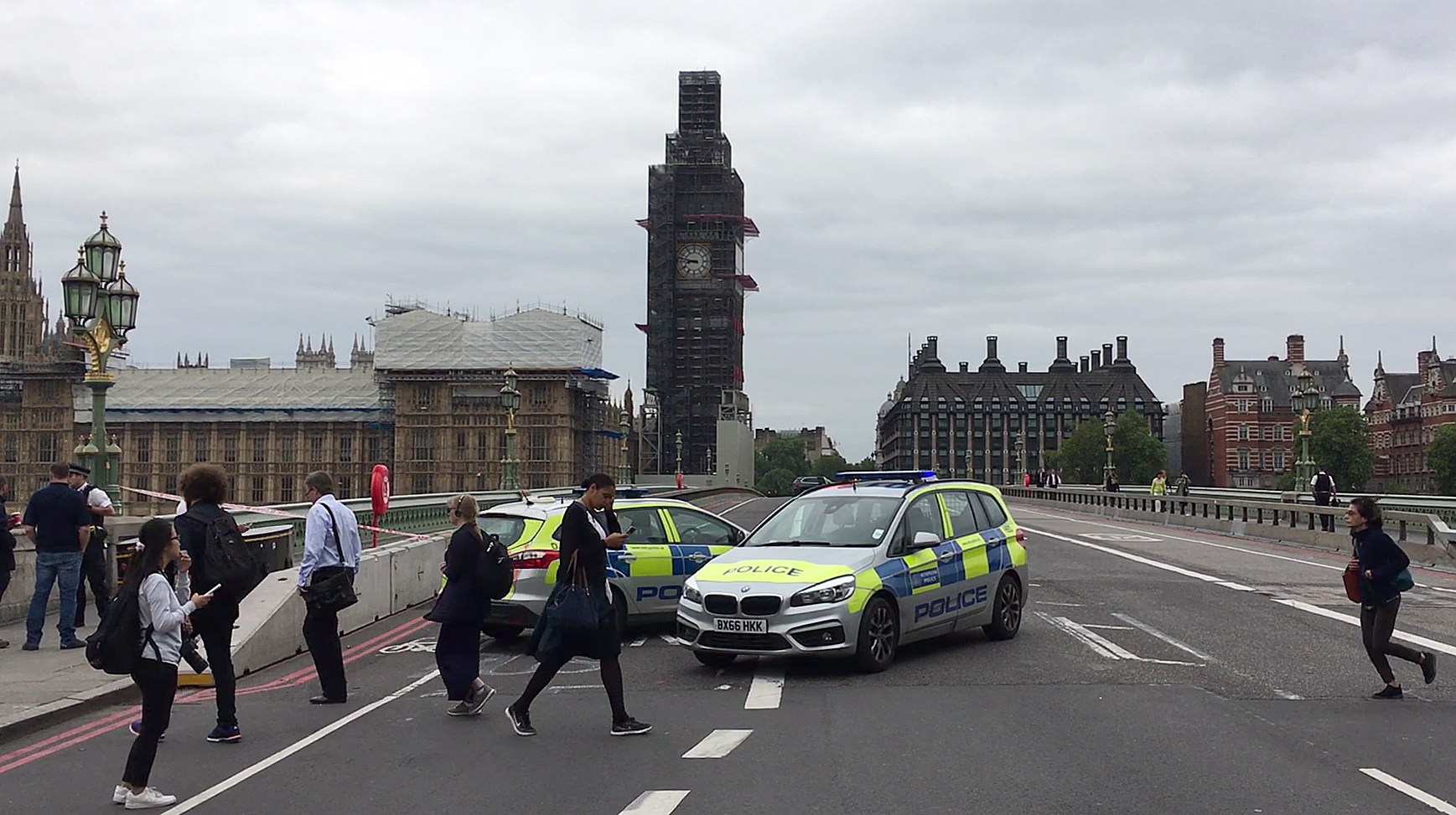 A video grab taken from AFP TV video footage shows police officers cordonning off Westminster Bridge, leading to Parliament Square in central London on August 14, 2018, after a car was driven into barriers at the Houses of Parliament. (WILLIAM EDWARDS/AFP/Getty Images)