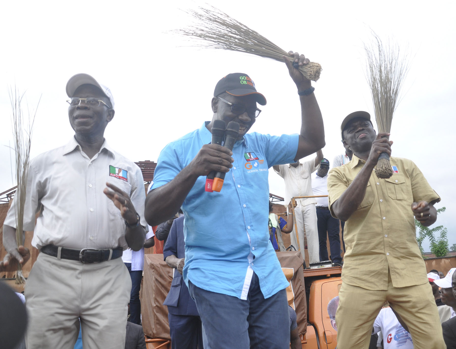 Godwin Obaseki, the candidate of the All Progressives Congress dancing at a campaign rally during his race for governor of Edo State. Beside him (left) is Governor Adams Oshiomhole, his political godfather.
