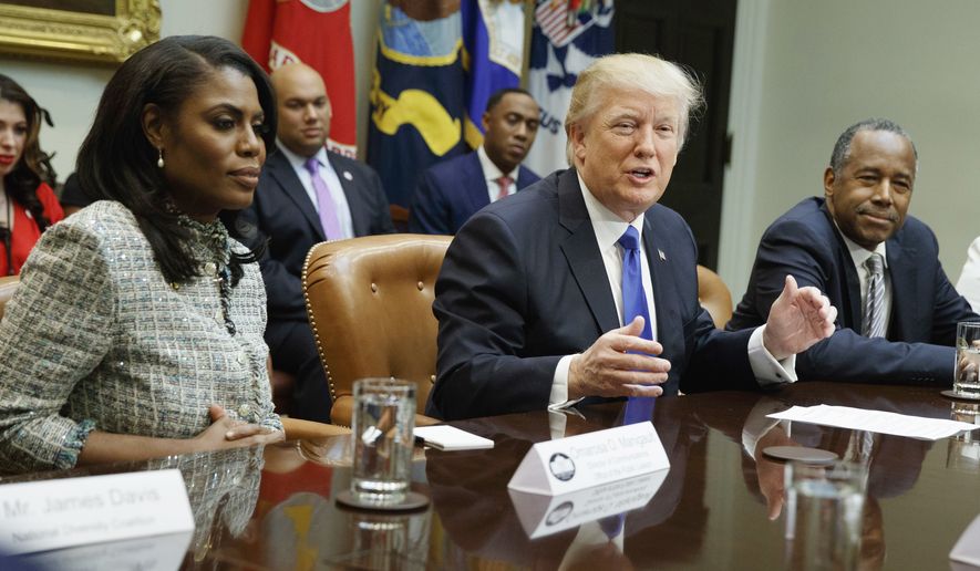Donald Trump speaks during a meeting on African American History Month in the Roosevelt Room of the White House in Washington, Wednesday, Feb. 1, 2017. From left are, Omarosa Manigault, Trump, Housing and Urban Development Secretary-designate Ben Carson, and Lynne Patton. (AP Photo/Evan Vucci) ** FILE **