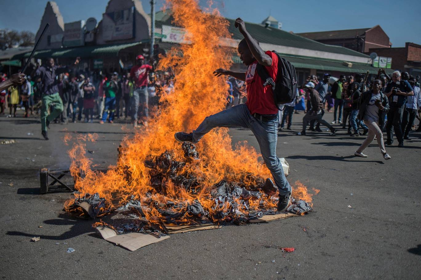 Opposition MDC party supporters protest in the streets of Harare during clashes with police AP