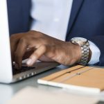 man laptop watch pexels-photo-1059122