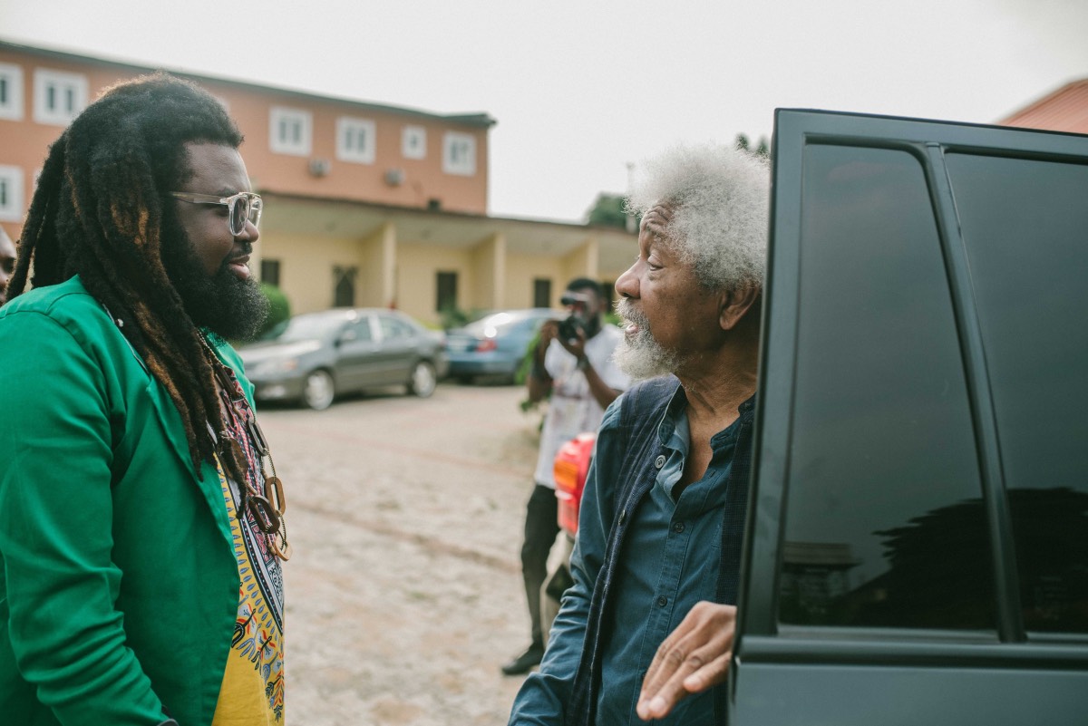 Onyeka Nwelue received Wole Soyinka as the Nobel laurent arrives at the venue of the film screening