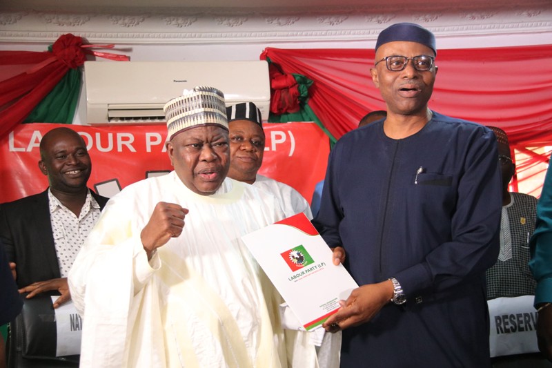 Former Governor of Ondo State/Presidential Aspirant of the LP, Dr Olusegun Mimiko, receiving nomination form from the National Chairman, of Labour Party, Alhaji Abdulkadri Abdulsalam.