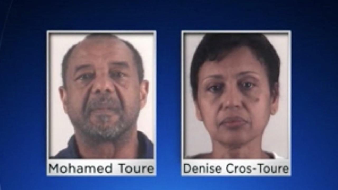 Mohamed Toure and his wife, Denise Cros-Toure, have been indicted on five counts of forced labor and alien harboring. They allegedly enslaved an African girl for more than 16 years. (Image source: Video screenshot)
