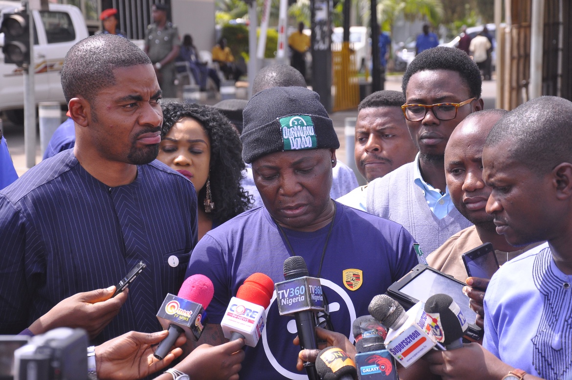 Deji Adeyanju (left) with Charly Boy (middle) as the Our Mumu Don Do and Concerned Nigerians movements stage a anti-government protest in Abuja in 2017