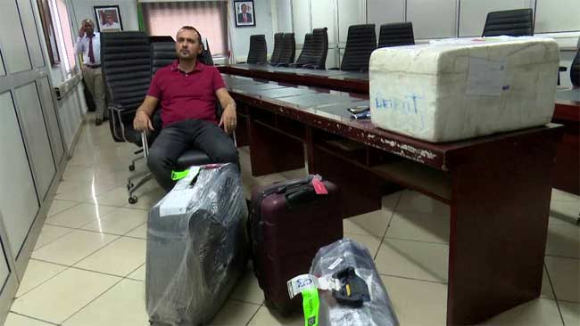 The suspect, Abbas Lakis, at the Abuja Airport on November 30, 2018 | EFCC Photo