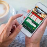 betting gambling online casino  person-betting-on-smartphone-in-cafe
