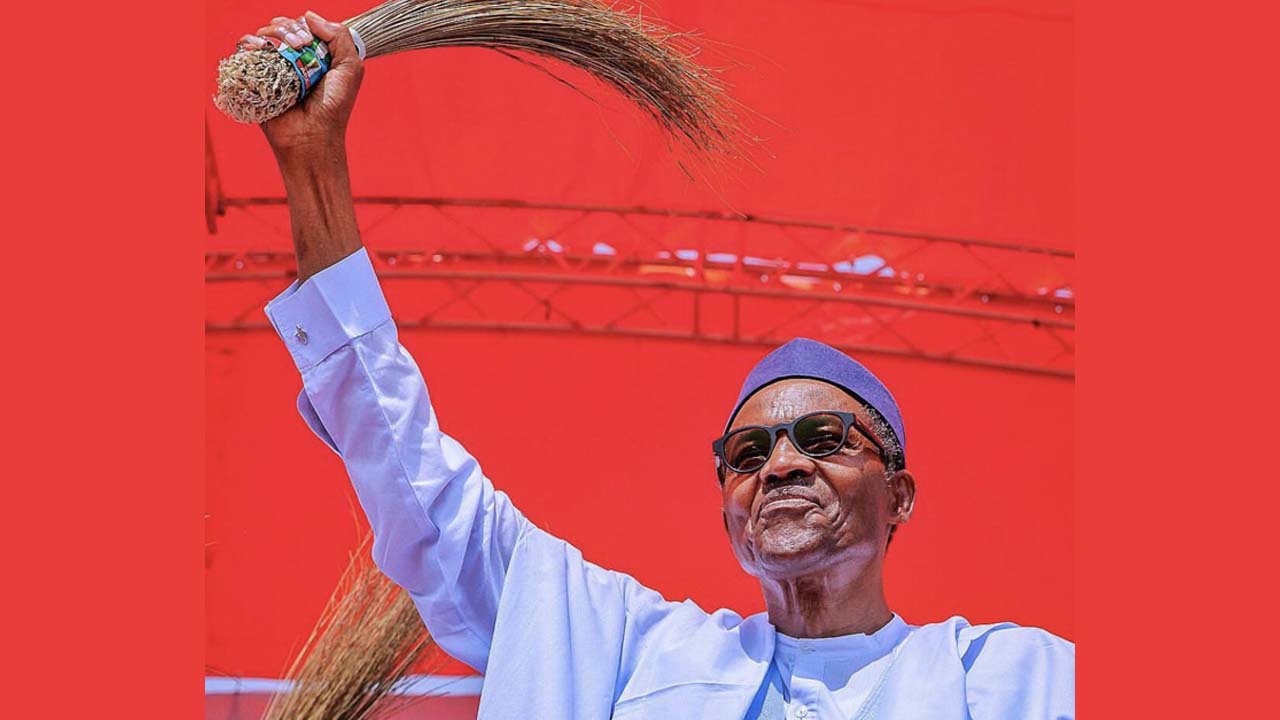Nigeria's President Muhammadu Buhari waves a broom, the symbol of his party, the All Progressives Congress, APC at a campaign event