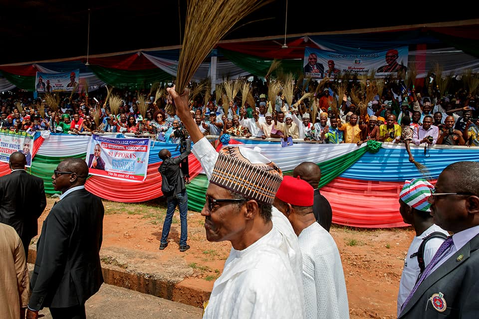 Nigeria's President Muhammadu Buhari waves a broom, the symbol of his party, the All Progressives Congress, APC at a campaign event