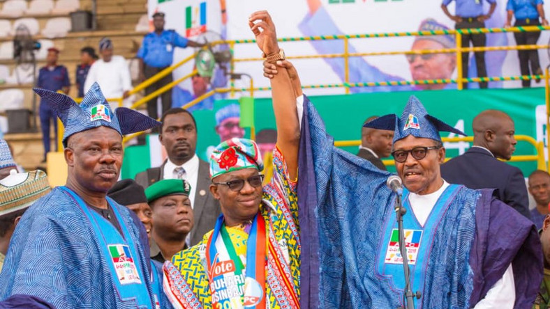 President Muhammadu Buhari (right) endorses Dapo Abiodun (centre) as the APC's Ogun governorship candidate, despite the public objection of Governor Ibikunle Amosun (left) [Ayodeji Ogunro]