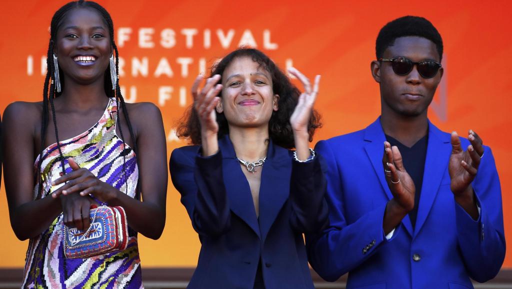Director Mati Diop (center) on May 16, 2019 in Cannes, where her film "Atlantic" is competing for the Palme d'Or.