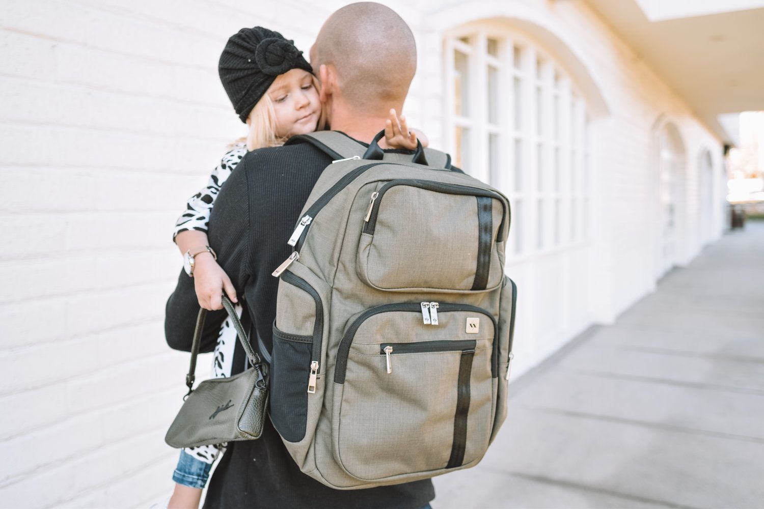 travelling mom dad father  baby backpack