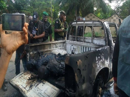 Victims of the police killings are loaded in a police pickup truck at Barrister Ifeanyi Ejiofor's residence at his home town, Oraifite, in Ekwusigo local government area of Anambra State, was murderously invaded by officers and men of the Nigerian Police Force in the morning hours of Monday 2nd December 2019.