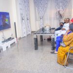 Valentine Ozigbo (in white) watching the finals of the African Freestyle Football Championship along with his secondary school alumi members on Sunday, Aug 2