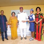 Valentine Ozigbo (middie) poses for a photo with one of the student awardees and Principal (far right) at the Annual Andrew And Christiana Ozigbo Excellence Awards Sun Aug 2 2020