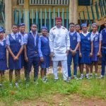 Valentine Ozigbo (middie) takes a picture with the students of his alma mater at the Annual Andrew And Christiana Ozigbo Excellence Awards at Christ The Redeemer College Amesi on Sun Aug 2