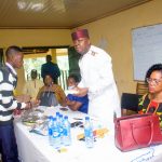 Valentine Ozigbo presents award to one of the receipients at the Annual Andrew And Christiana Ozigbo Excellence Awards at Christ The Redeemer College Amesi on Sun Aug 2